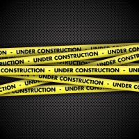 under-construction-warning-tape-metal-background_1048-1373